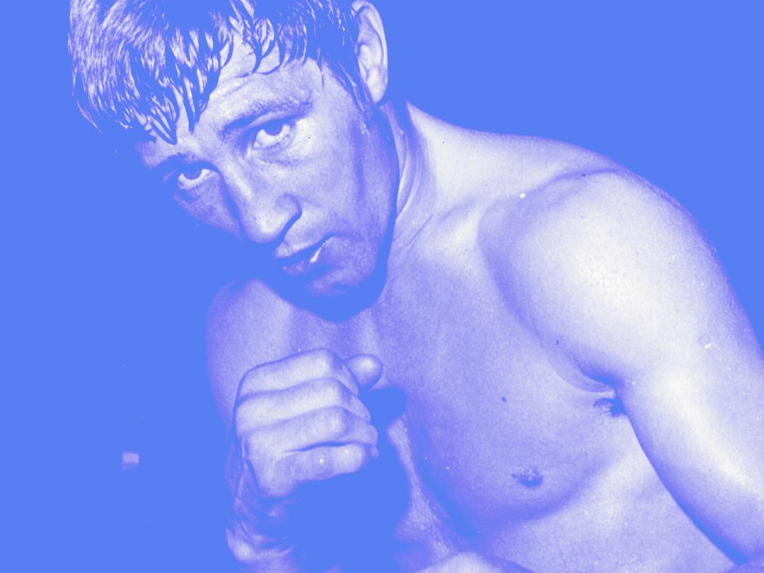 Archive photograph of the boxer Ken Buchanan with his guard up, tinted blue