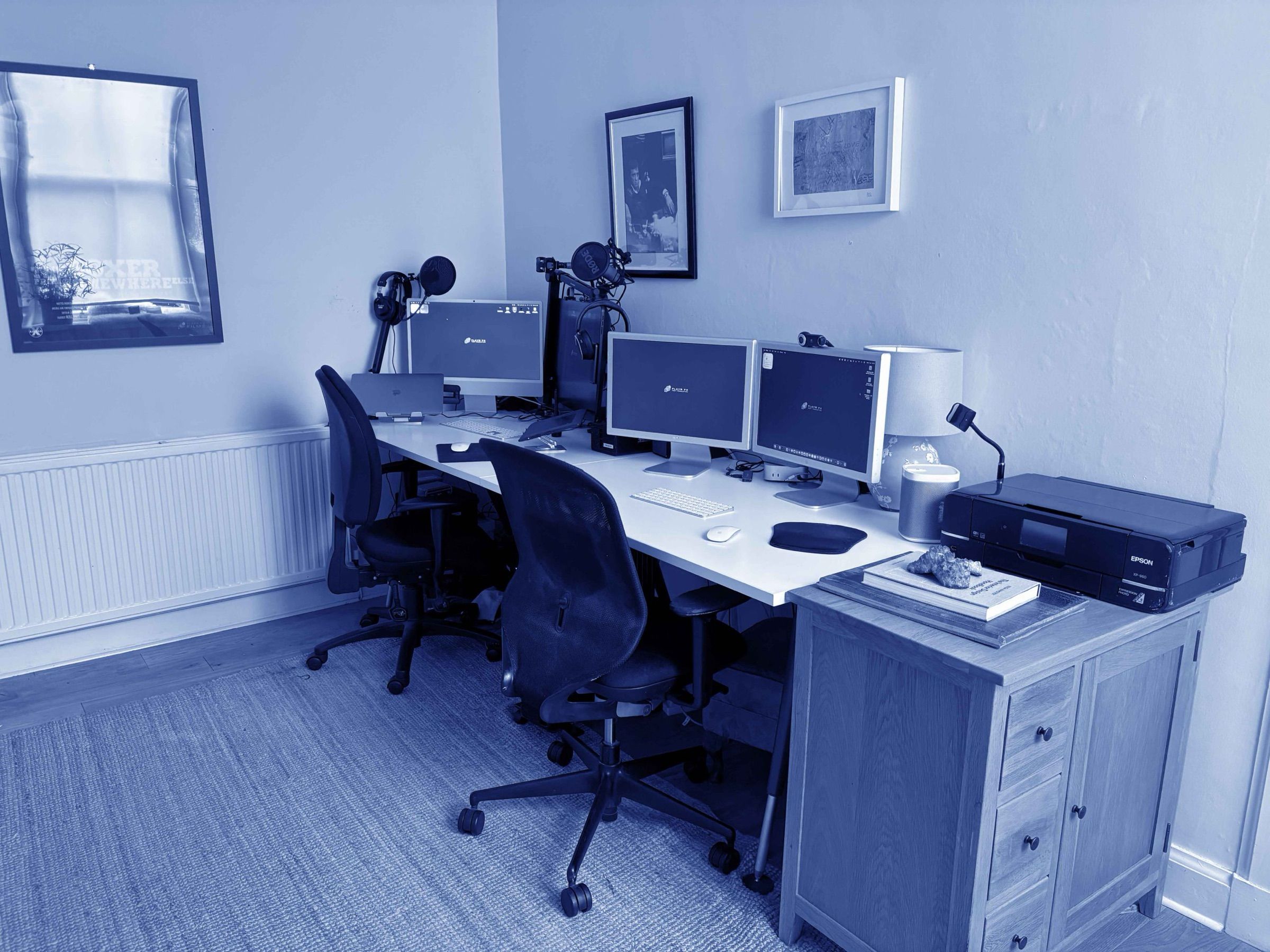 The Edinburgh podcast studio: two microphones on arms across a desk, with cameras and soft lighting
